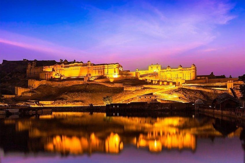 A historic fort with a moat, illuminated by artificial lighting. 5