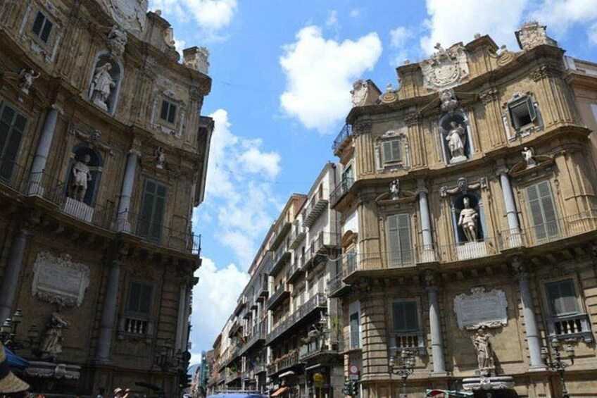 A historic building with ornate facades and statues. 2
