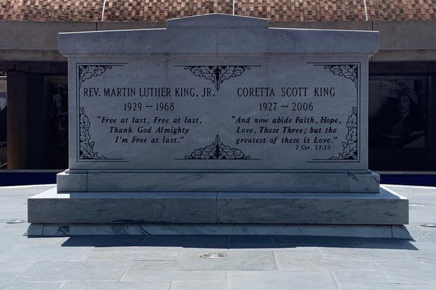 A memorial monument with engraved names and quotes. 3