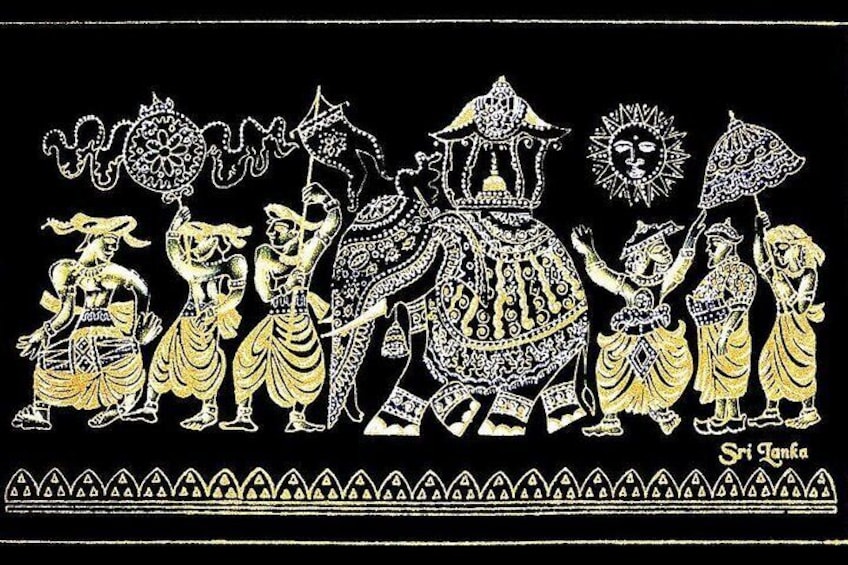 A traditional Sri Lankan dance performance with dancers and an elephant. 3