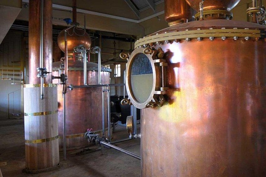 Industrial copper distillation columns with valves and pipes. 2