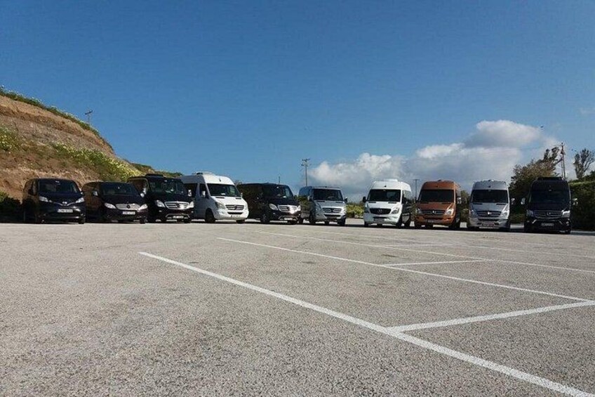 A parking lot with several vehicles. 5