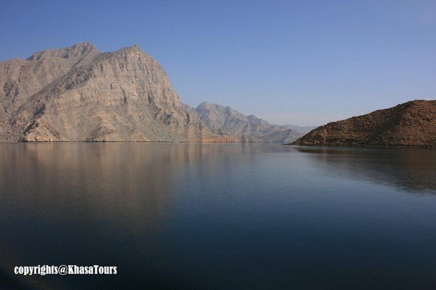 A calm lake with mountains in the background. 3