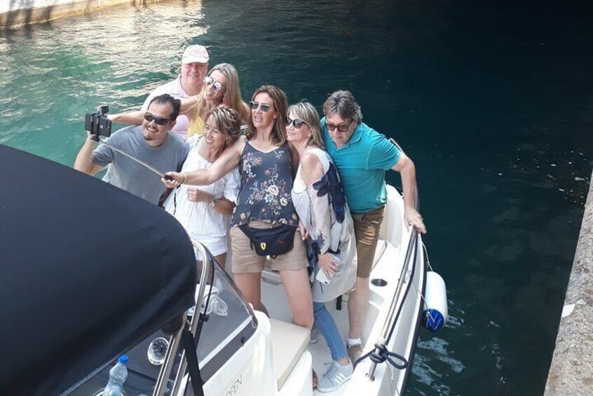 A group of people on a boat near a dock. 3