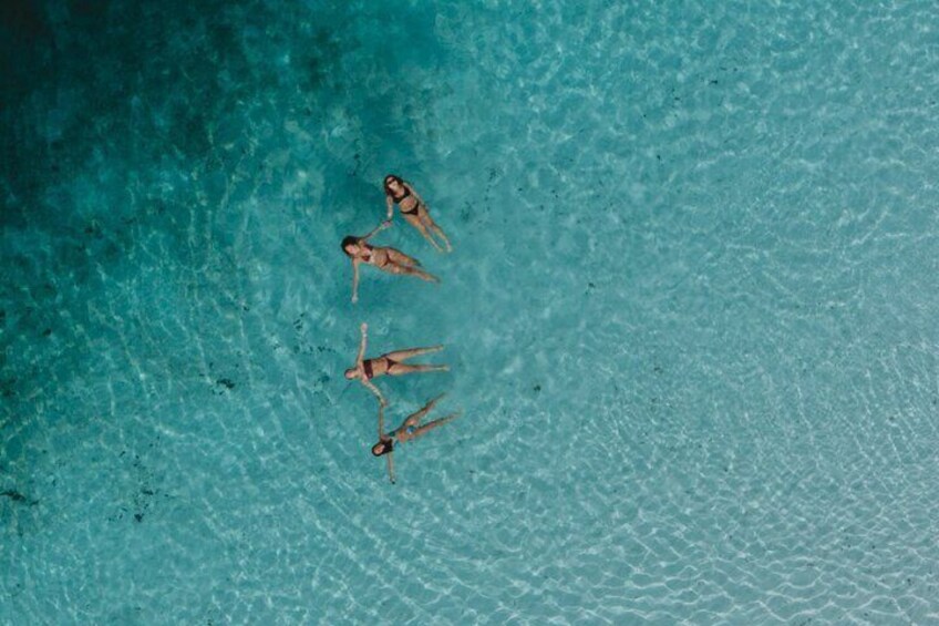 Swim in the crystal-clear waters of Boorangoora (Lake McKenzie)