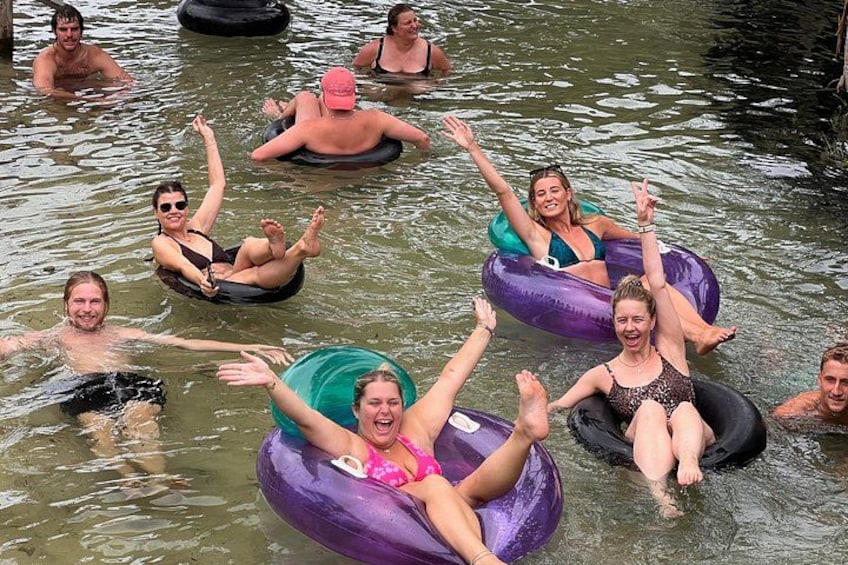 People floating on water using inflatable tubes. 3