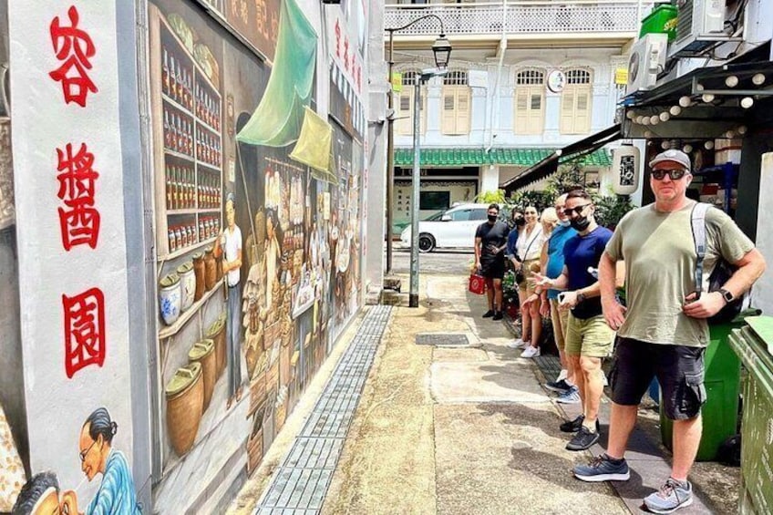 Our alleys have been given a new lease of life, as our American, Australian & English guests pose at a wall mural depicting everyday life in an old school coffeeshop and vegetable & seafood market. 2