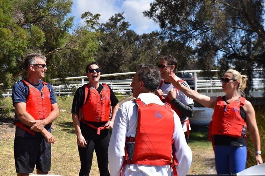 The crew receiving paddling and safety tips before a fun day