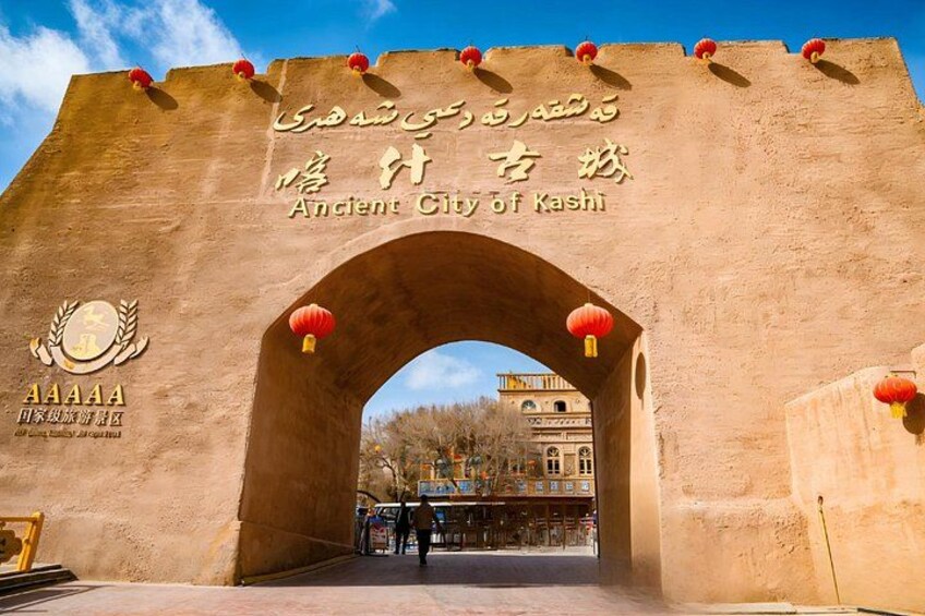 An ancient city gate with inscriptions and lanterns. 4