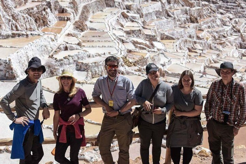 Small group with guide having a break in the salt mines of Maras. 4
