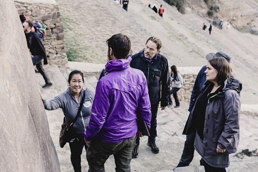 Guide explains history of ruins in Ollantaytambo. 2