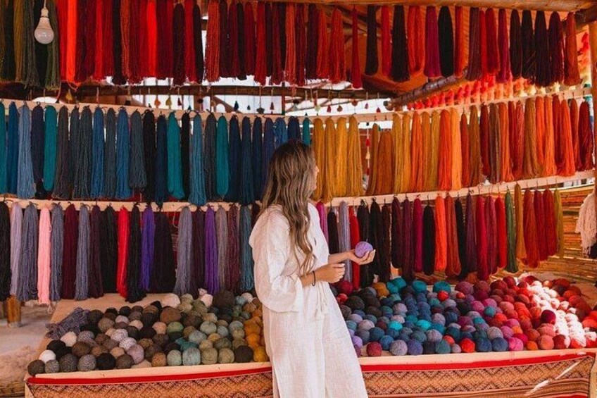 Traveler is impressed by colors of alpaca wool. 2
