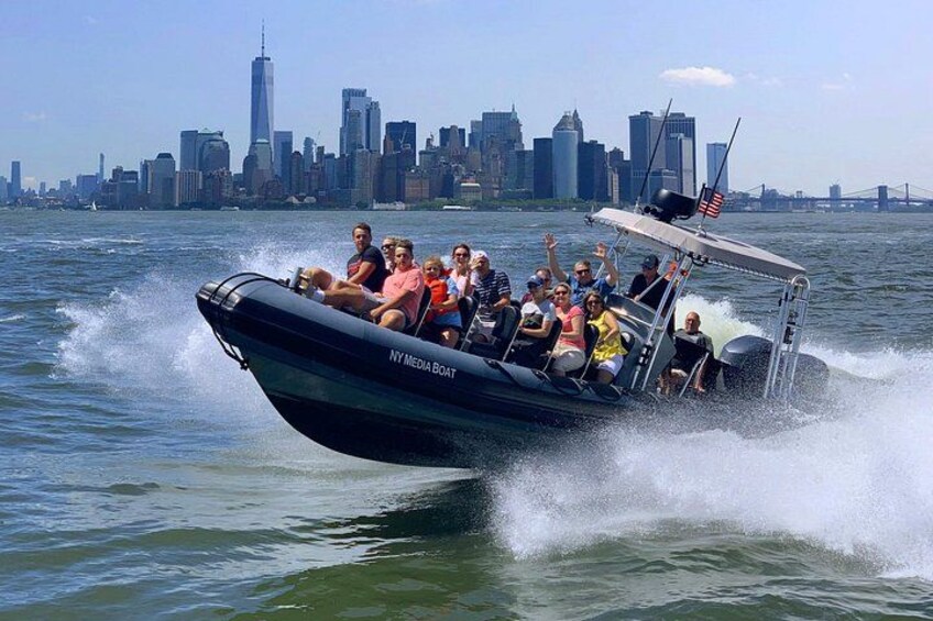 A boat with passengers, a city skyline in the background, and a bridge. 3