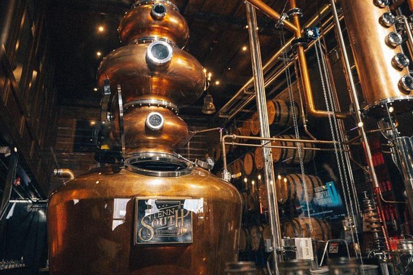 A large copper distillation apparatus with a label reading 'Lennith South.' 1