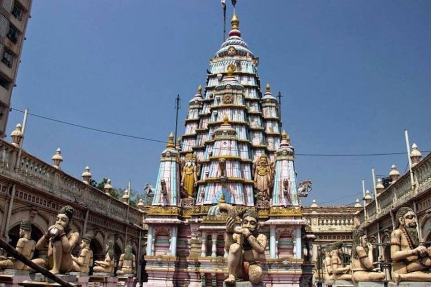 A multi-tiered temple with intricate carvings and statues. 2