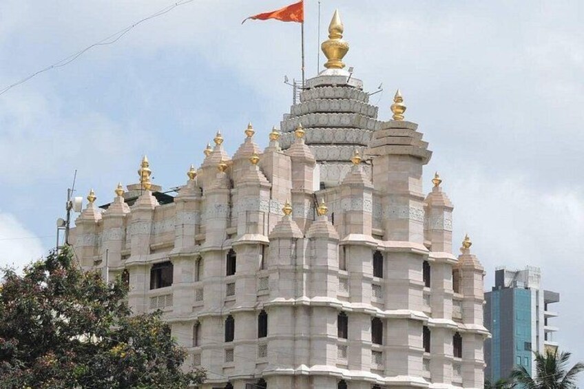 A temple with multiple spires and golden ornaments. 1
