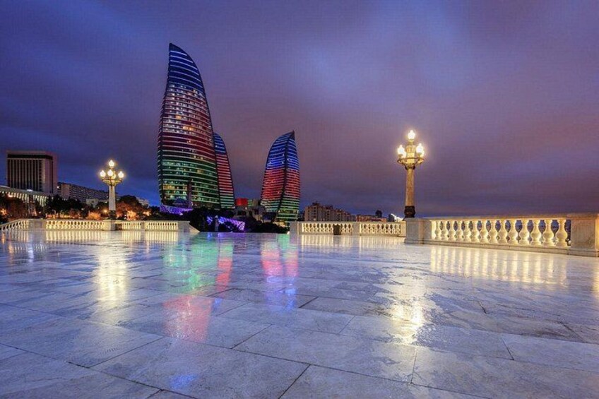 A waterfront with modern buildings and a bridge. 3