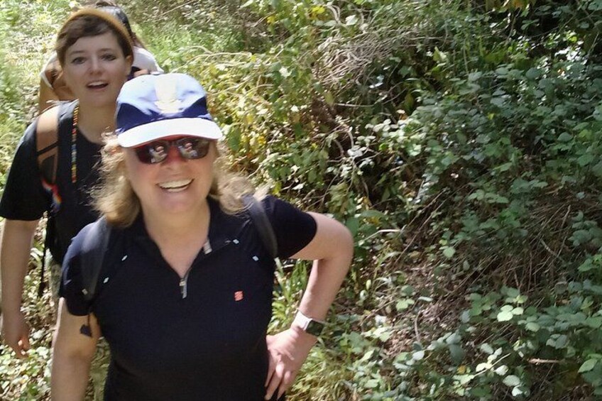 Two people hiking in a wooded area. 5