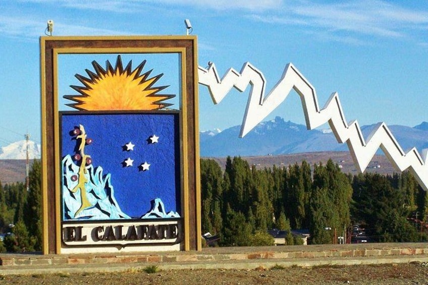 A sign with a sun, stars, and a mountain range in the background. 1