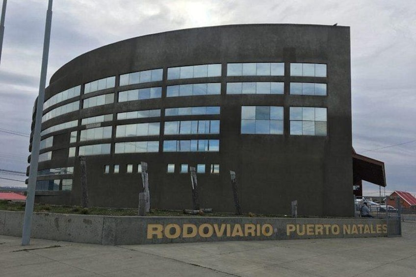 A modern building with a curved facade and multiple windows. 4