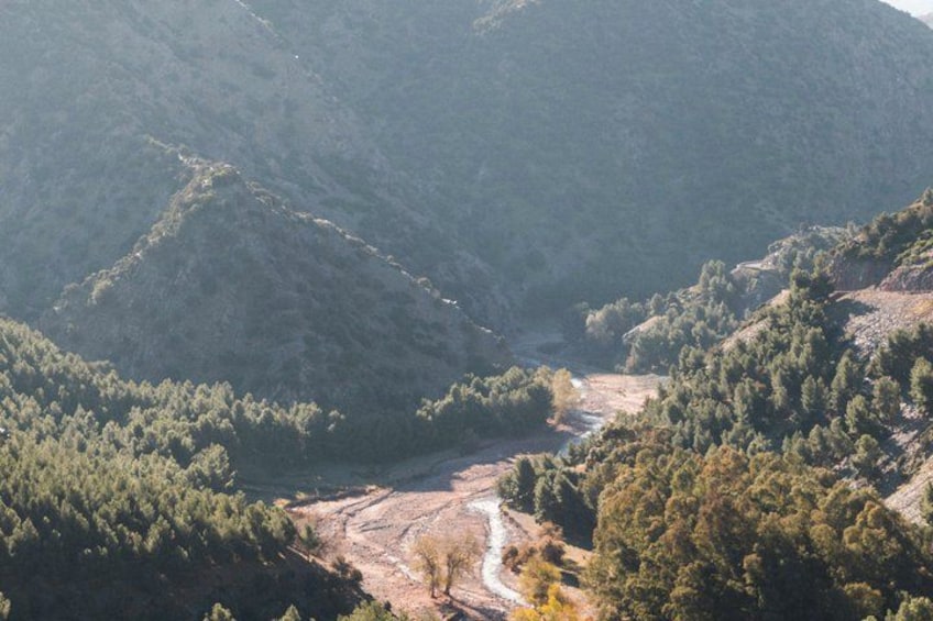 A mountainous landscape with a river flowing through a valley. 5