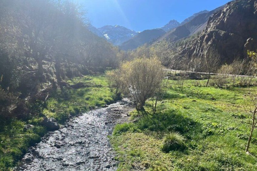 A river flowing through a valley with mountains in the background. 2