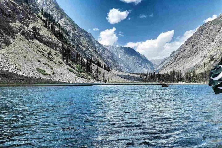 A mountain lake with a boat. 3