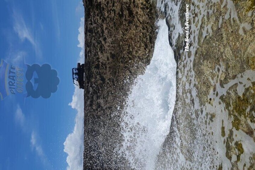 A rocky coastline with waves crashing against the shore. 5