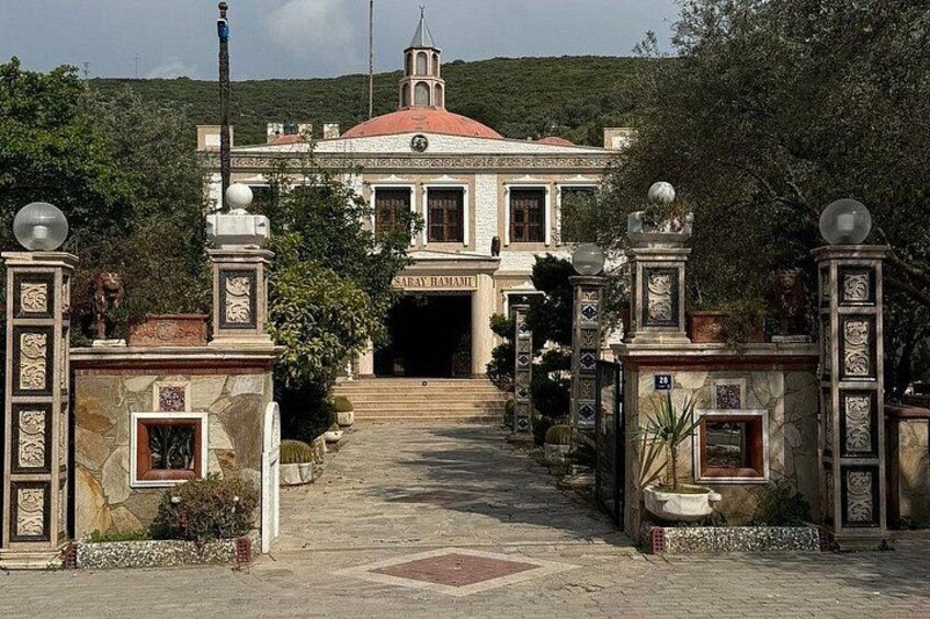 A grand entrance with a red-tiled roof, ornate gates, and a building labeled 'SABAYRAMI'. 4