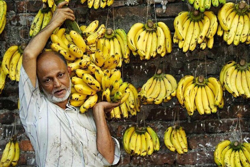 Old Dhaka: Armanitola area; Banana hanging on a wall 3
