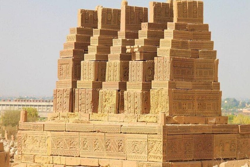 A large, multi-tiered stone structure with intricate carvings, likely a historical monument or temple. 2