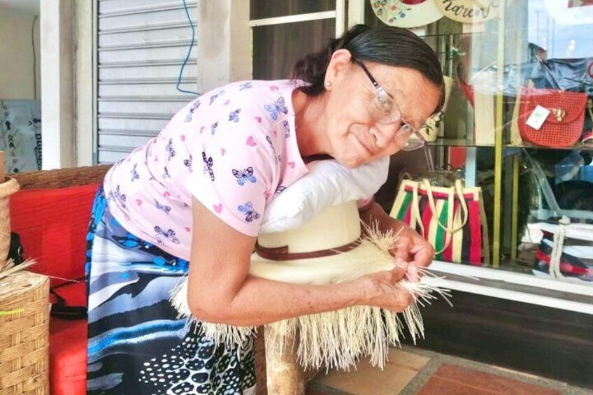 A person working on a woven basket. 2