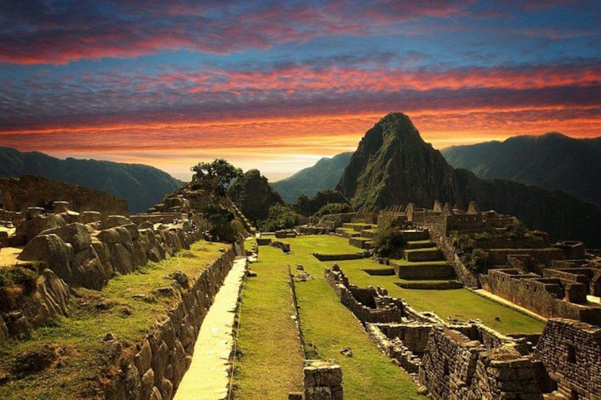 Machu Picchu ruins, Inca stone structures, and a mountain backdrop. 3