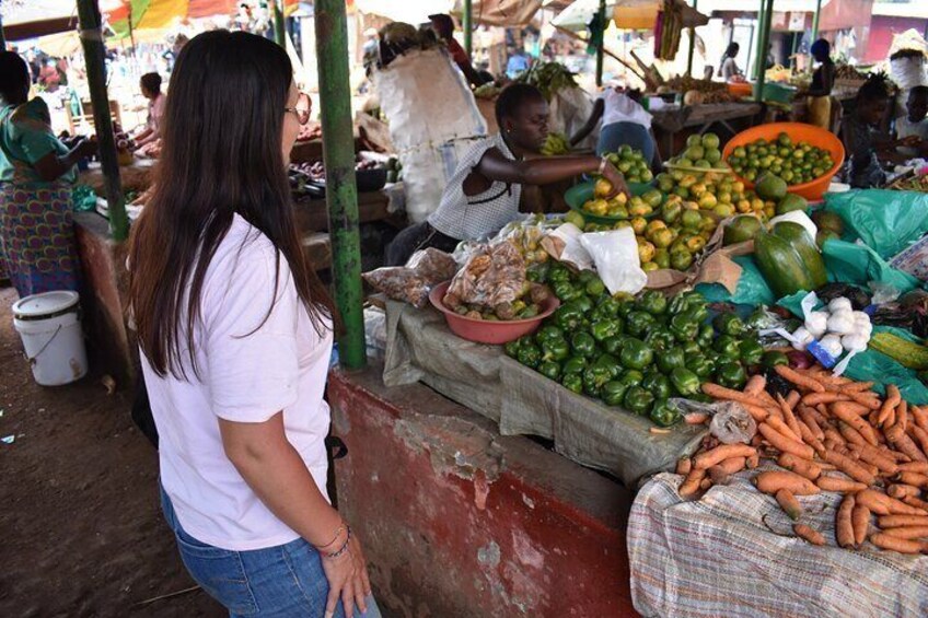 A market with various vegetables like carrots and green peppers. 3