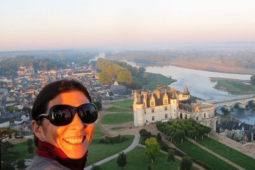 A castle overlooking a river and town. 2