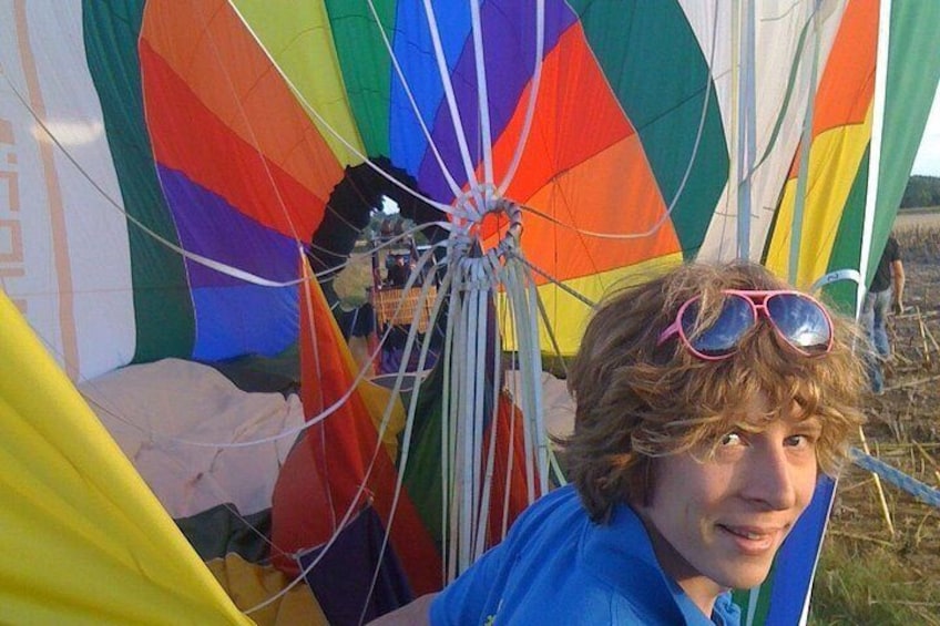 A person with a colorful parachute behind them. 3
