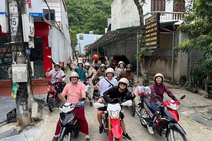 A group of people on motorcycles in an urban street. 3