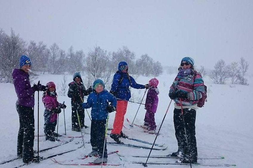 A group of people skiing on a snowy slope. 3
