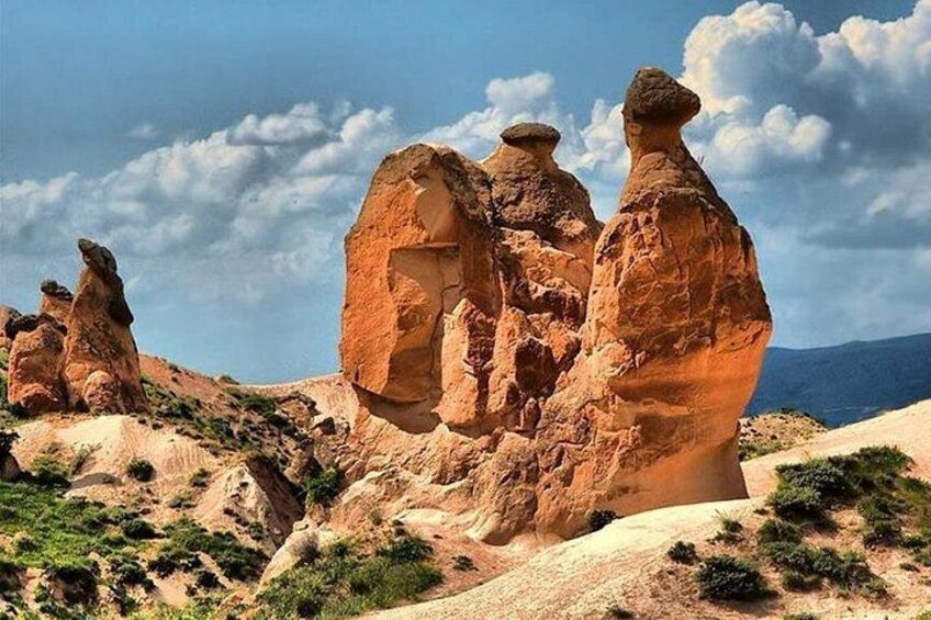 A desert landscape with prominent rock formations. 1