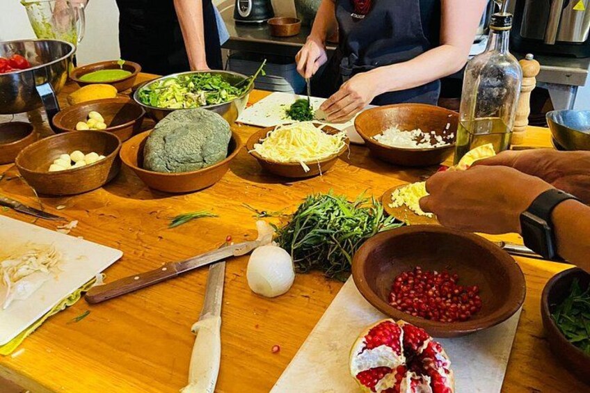 A kitchen with various ingredients and utensils, including bowls, a knife, and a cutting board. 3