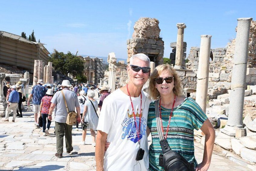 Tourists at an ancient archaeological site with ruins and columns. 3