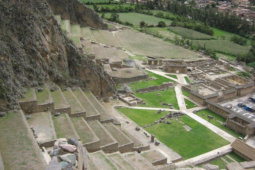 An ancient archaeological site with terraced structures and ruins. 2