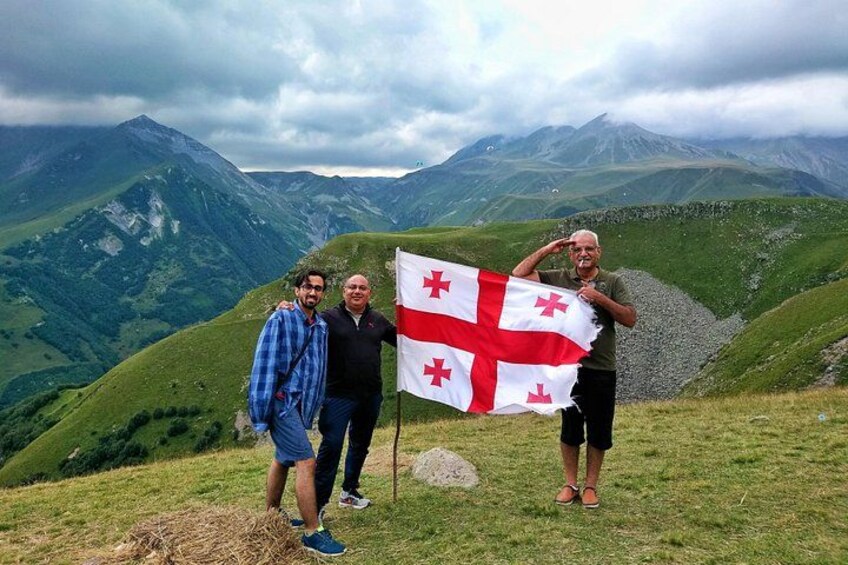 A mountainous landscape with a flag. 5