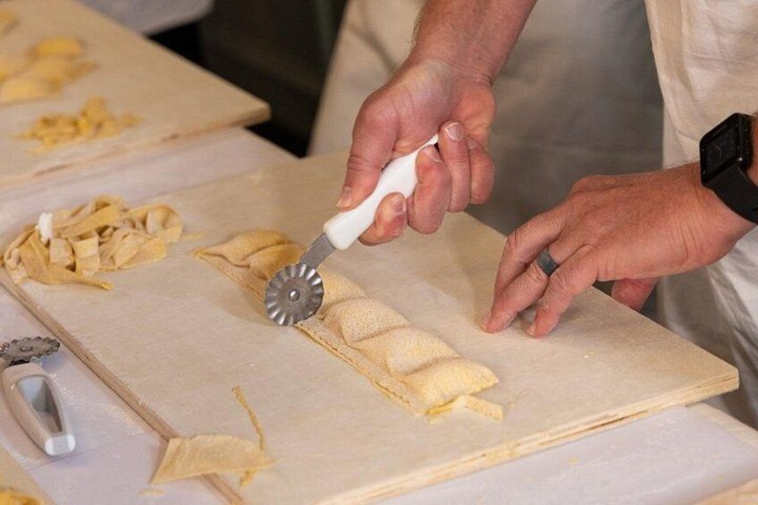 Cutting fresh ravioli by hand. 2