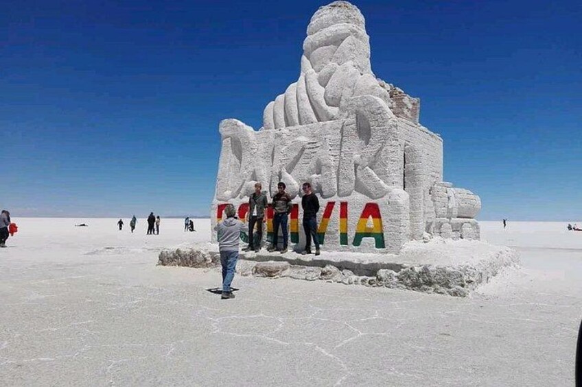 A large snow sculpture of a figure with the word 'VIA' in colorful letters. 5