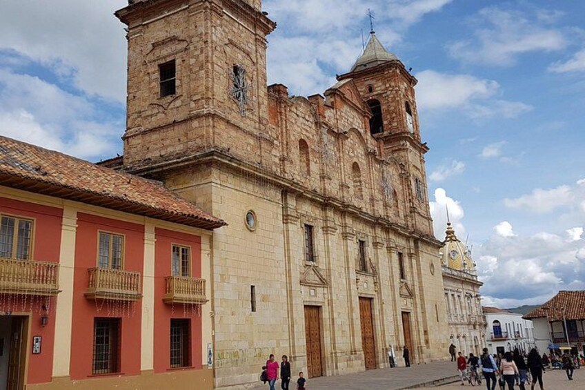 A historic building with a bell tower, a clock, and a dome. 2