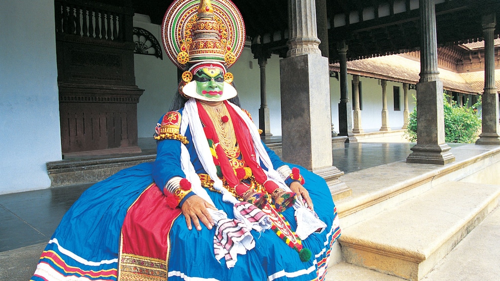 Performer sitting at the Kathakali Dance Show in Kochi 