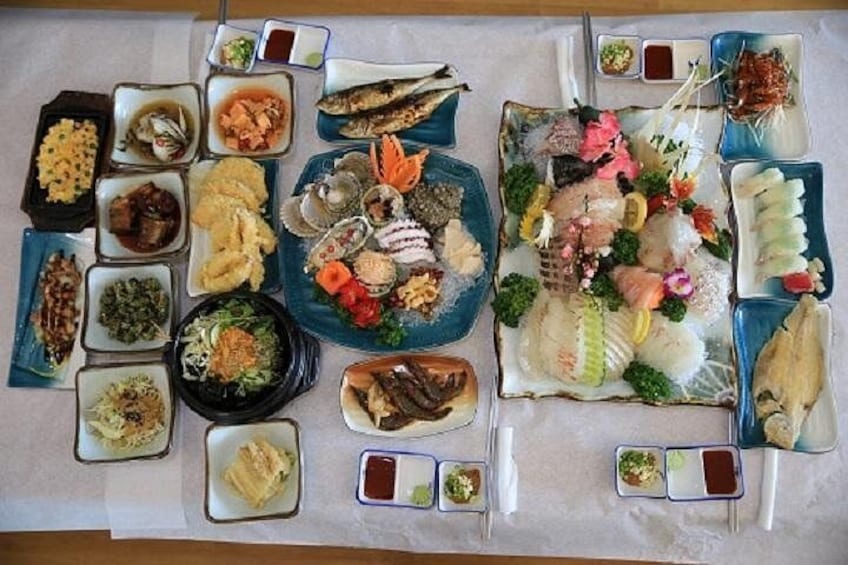 A variety of seafood dishes arranged on a table. 1