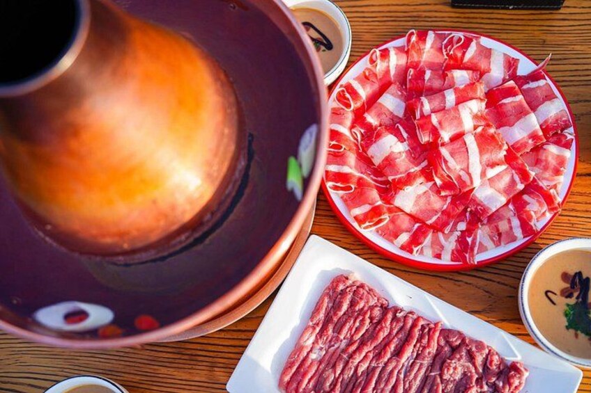 Thin slices of mutton and beef are quickly cooked in the pot and then dipped in a sauce made with sesame paste…plus grab a pint of local craft beer! 2