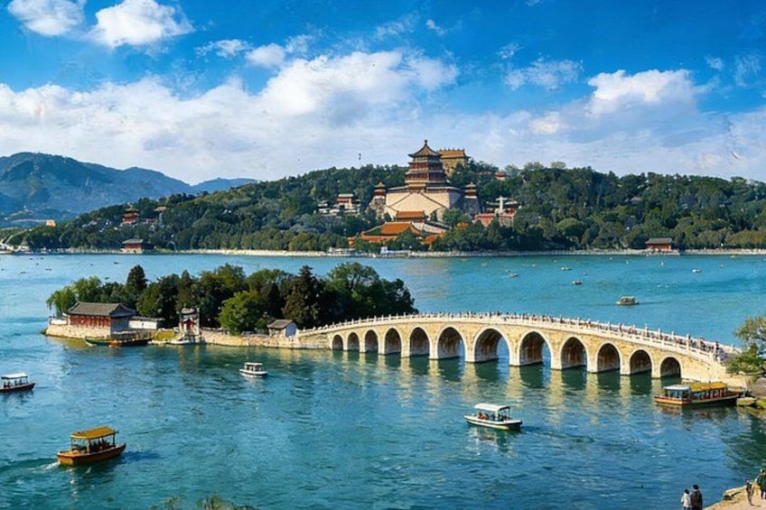 A bridge over water, a pagoda, and a mountainous landscape. 2